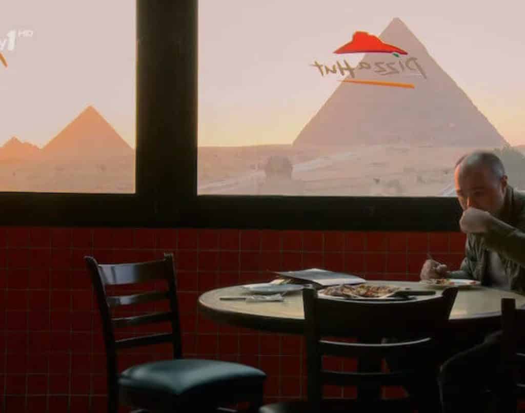 <p>There is no denying that the Pyramids of Giza are one of the world’s greatest wonders. Likewise, we would argue that pizza is also a world wonder. However, for some reason, it just does not seem right that a person can sit inside a fast-food pizza place and enjoy the view of this phenomenon of mankind.<br>As sacrilegious or surreal as it seems, this image is absolutely real. Now, you can travel all the way to Egypt only to enjoy questionable pizza and breathtaking views. We wonder how the ancient pharaohs would feel about this arrangement. After all, they never got to taste delicious pizza, so there’s a chance they might think this is fantastic!</p>