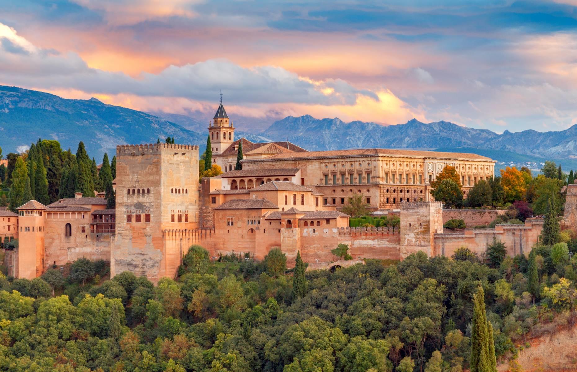 <p>Built by the Islamic monarchs of Andalucia on a leafy plateau above the city of Granada, the majestic Alhambra is a sight to behold. This fortified palace was primarily constructed between 1238 and 1358, though several sections were reworked when Spain reverted to Christianity in the 16th century.</p>  <p>But the Arabesque influence still looms large in the Alhambra's architectural details and decor, like its elaborate archways, painted tiles, and reflecting pools.</p>