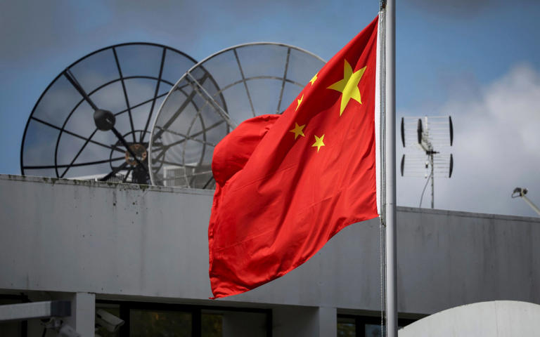 The Chinese flag flies at the Chinese Consulate in Auckland, New Zealand, Tuesday, March 26, 2024. Hackers linked to the Chinese government launched a state-sponsored operation that targeted New Zealand's Parliament in 2021, the country's security minister said. (Jason Oxenham/New Zealand Herald via AP) - Jason Oxenham/AP