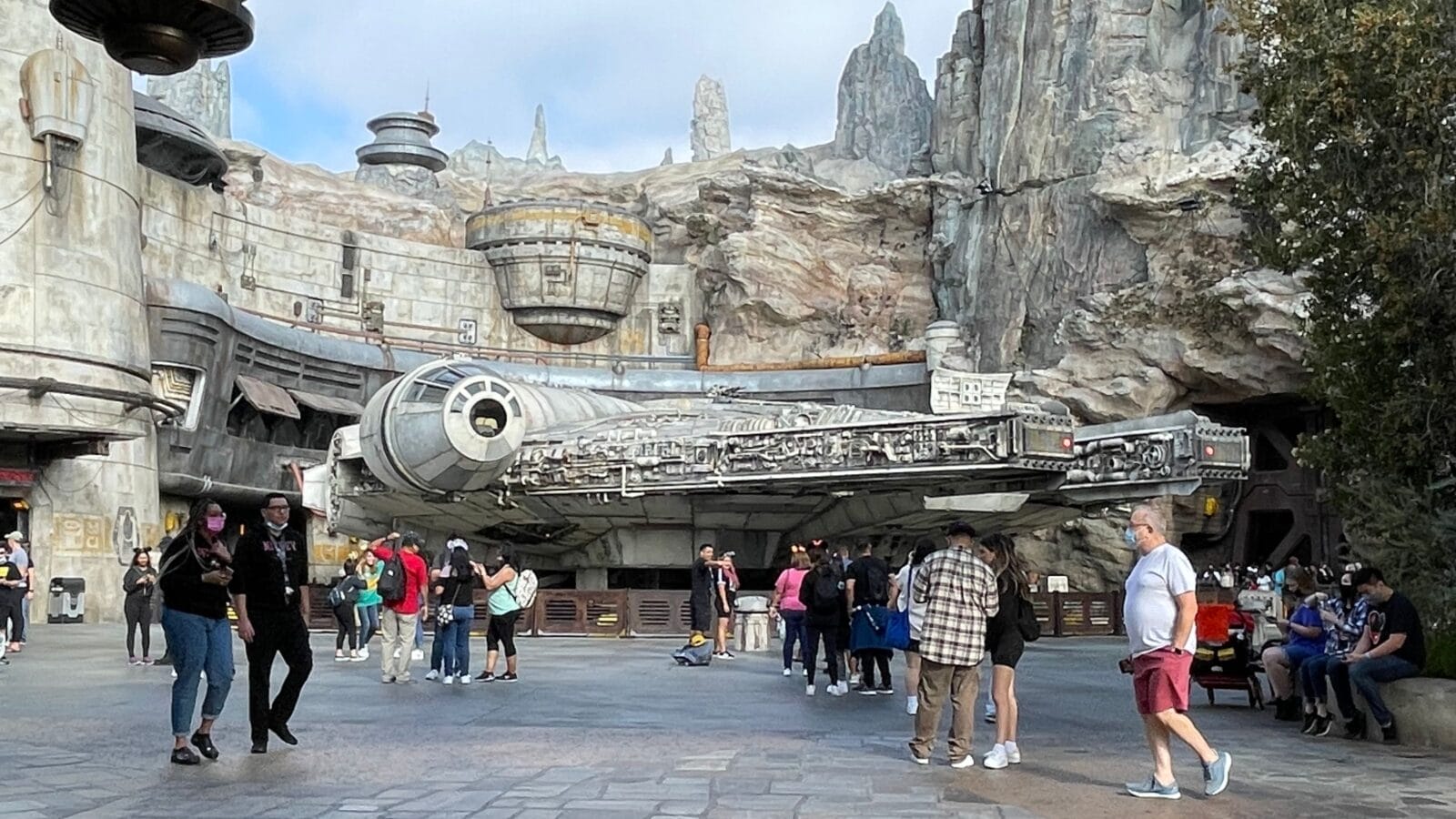 <p><strong>Same Galaxy, slightly difference orientation.</strong> As a visitor to Disney parks on both coasts, the Star Wars Galaxy’s Edge area will feel very similar with one exception: the lands are oriented slightly different. It’s just enough to make you have deja vu with the Disneyland version facing another direction and with more entrances/exits to other lands. They also have different food and drink options. For instance, the Oga’s Cantina at Disneyland recently started serving a new five-blossom bread which is basically a large pretzel with garlic dipping sauce but it isn’t available at the the Florida location. However, Walt Disney World was the the only location to get the now-defunct Galactic Starcruiser 2-day experience. <strong> Helpful tip:</strong> I’ve discovered that if you have a reservation at Oga’s in Disneyland this will usually guarantee you a table (but you might have to share it with strangers). At Oga’s in Walt Disney World in Florida, a reservation just gets you in the door and the tables are just pure luck.</p>
