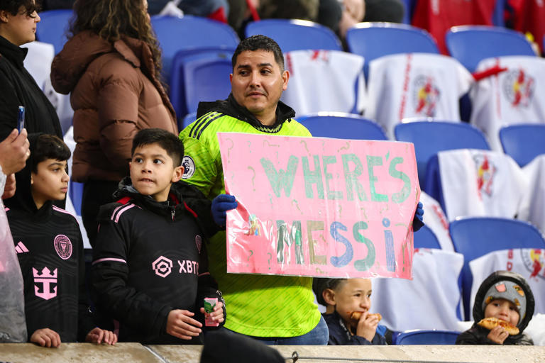 Mar 23, 2024; Harrison, New Jersey, USA; A fan holds up a sign for Inter Miami CF forward Lionel Messi (not pictured) before the match against the New York Red Bulls at Red Bull Arena.