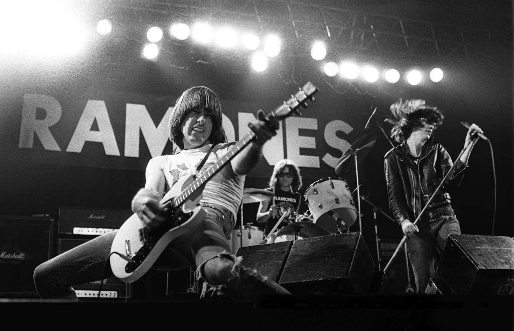 If Lou and Reed and Velvet Underground were the pioneers of the punk movement in America, the Ramones were the undisputed superstars. Two-plus-minute songs, minimal chord structure, and, of course, the look. Joey, Johnny, Dee Dee, and Tommy, sporting their trademark leather jackets became rock and roll icons while delivering their updated version of the early Beatles’ days. But the band was more than just speed and camp. Its lyrics were political (“Bonzo Goes to Bitburg”), and attacked antisemitism and Nazism (“Today Your Love, Tomorrow the World”). Though all four original members have died, the Ramones’ legacy lives on and is widely celebrated.