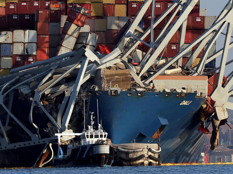 Crushed shipping containers are seen on the bow of the Dali after it struck the Francis Scott Key Bridge, on March 29, 2024 in Baltimore.