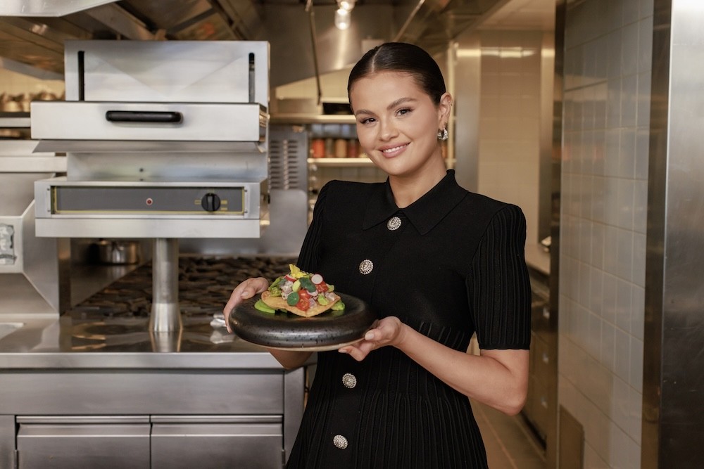 <p>Selena Gomez is heading out into LA for her new TV show <em>Selena + Restaurant</em>. Instead of having chefs Zoom into her own kitchen, Selena will be joining them in theirs! We'll see everyone from Ms Chi's Shirley Chung and Girl & the Goat's Stephanie Izard to CUT's Wolfgang Puck. I'm already hungry.</p><p><em>The first two episodes of Selena + Restaurant hit Food Network and Max on May 2. The show stars Selena Gomez and Raquelle Stevens alongside their guest chefs.</em></p>