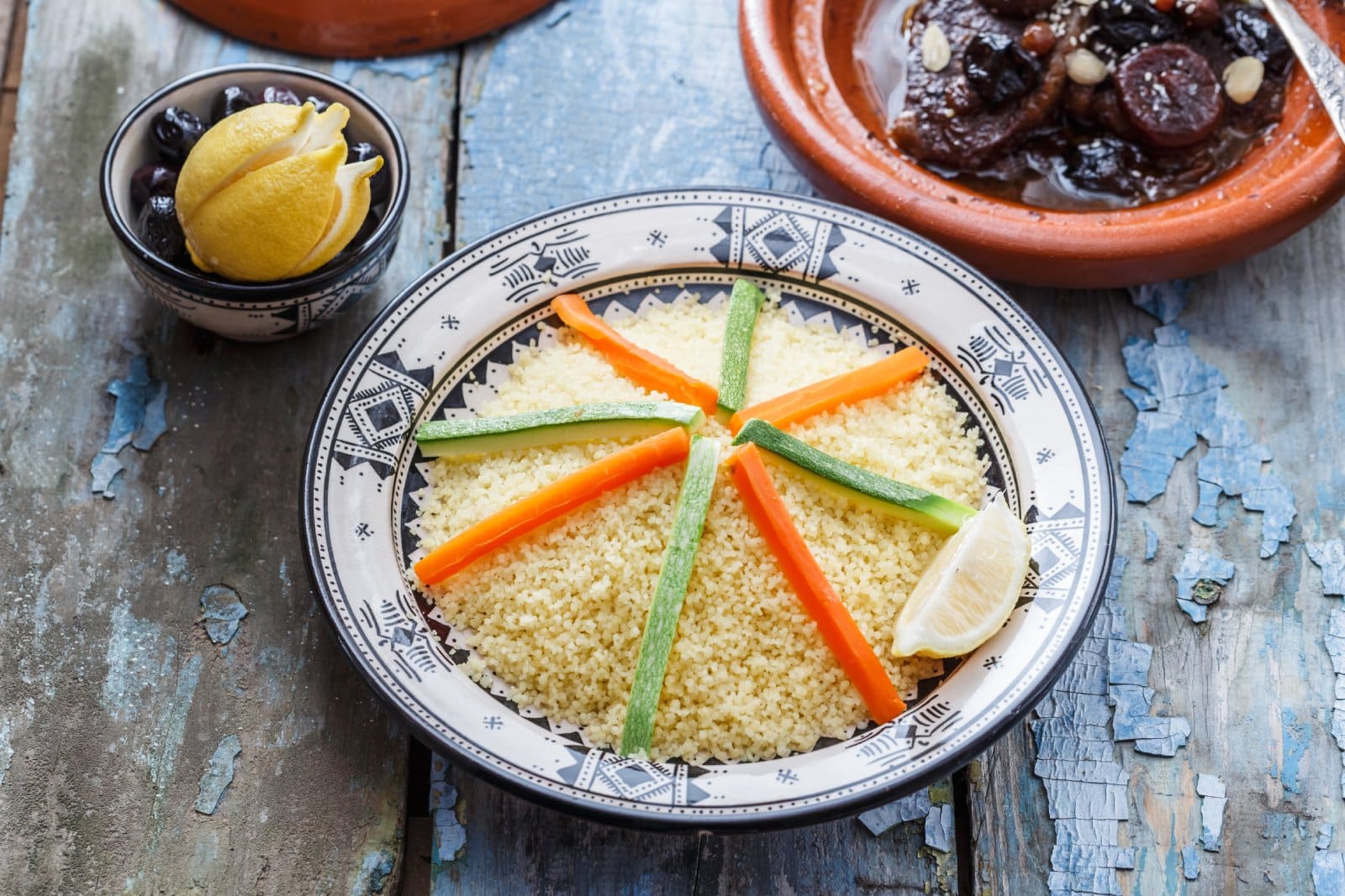 Image Credit: Shutterstock / Konstantin Kopachinsky <p><span>Explore the vibrant flavors of Moroccan cuisine in the bustling streets of Marrakech. Sample tagines, couscous, and Moroccan pastries in the city’s bustling markets and traditional riads.</span></p>