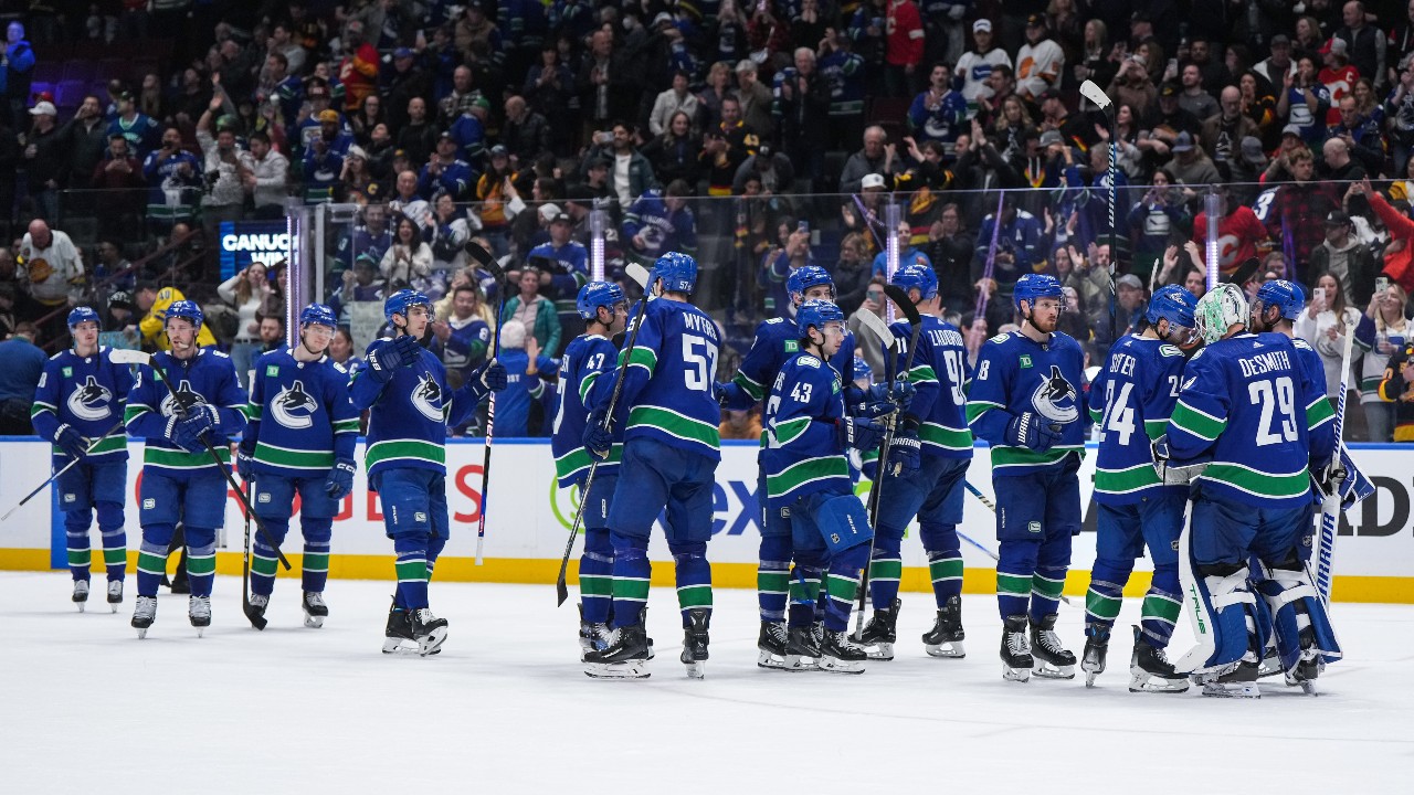 canucks clinch pacific division title with win over flames