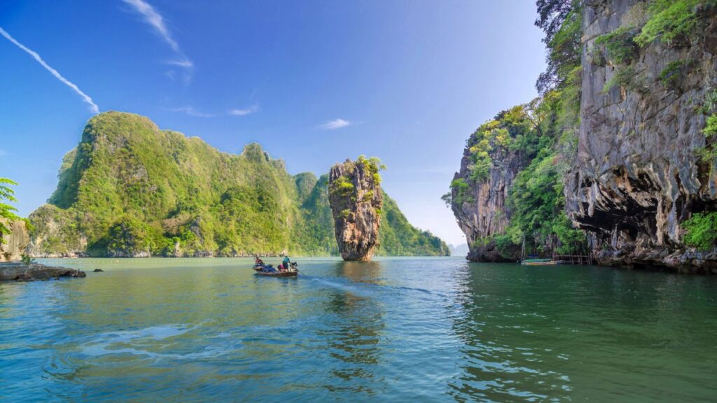 <p>Phang Nga Bay is famous for its stunning limestone cliffs, green waters, and James Bond Island! The 1974 Bond film, 'Man With The Golden Gun,' featured the bay and is a highlight for many visiting Phuket. Day trips usually include Koh Panyee floating village stop-offs, some caves, kayaking, and snorkeling.</p>