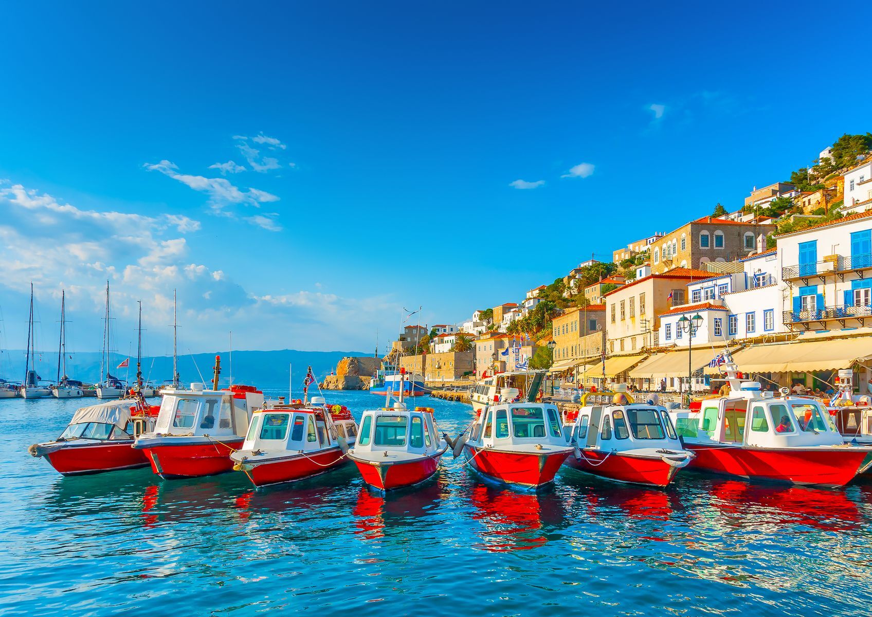 Considered one of the most beautiful <a href="https://www.greeka.com/saronic/" rel="noreferrer noopener">Saronic islands</a>, <a href="https://www.visitgreece.gr/islands/saronic-islands/hydra/" rel="noreferrer noopener">Hydra</a> offers a timeless escape with picturesque charm, car-free streets, a lively port, and bucolic whitewashed houses. Explore the <a href="https://www.greeka.com/saronic/hydra/sightseeing/monastery-prophet-elias/" rel="noreferrer noopener">Monastery of Prophet Elias</a> or relax on <a href="https://www.greeka.com/saronic/hydra/beaches/" rel="noreferrer noopener">pebble beaches</a> beside crystal-clear waters. Indeed, Hydra is sure to please naval history buffs, artists seeking inspiration, and travellers looking for a peaceful escape.