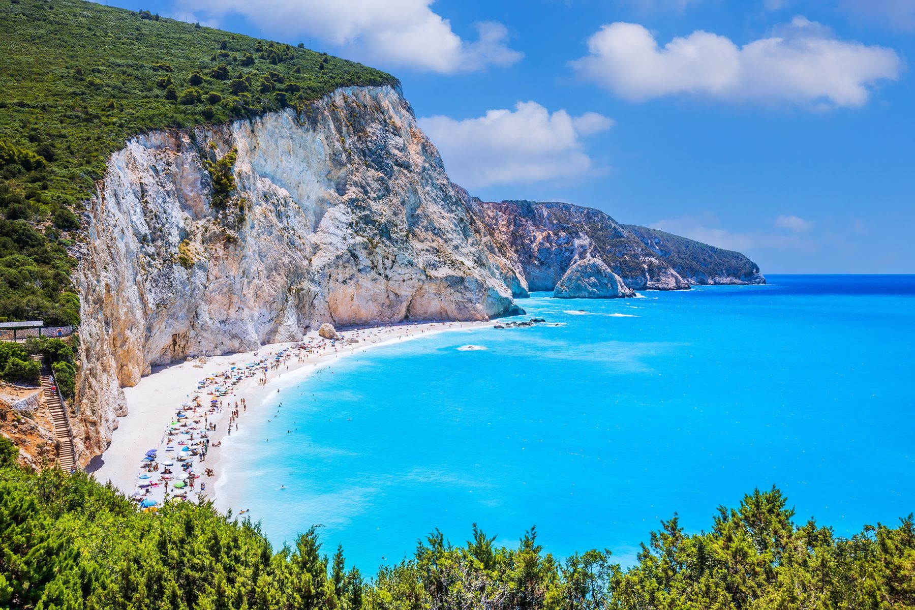 Dreaming of a seaside getaway? It’ll be love at first sight on <a href="https://www.discovergreece.com/ionian-islands/lefkada" rel="noreferrer noopener">Lefkada</a>, an idyllic island in the Ionian Sea. Located in the middle of what’s known as the “Caribbean of Greece” due to its tropical climate, Lefkada offers relaxing excursions to paradise <a href="https://www.lefkada-travel.com/en/beaches-in-lefkada-island" rel="noreferrer noopener">beaches</a>, like Porto Katsiki and Egremni, where visitors can swim in deep blue waters. Those who want to get moving should explore the pretty village of <a href="https://www.greeka.com/ionian/lefkada/villages/nidri/" rel="noreferrer noopener">Nidri</a> or try their hand at kitesurfing in Myli.