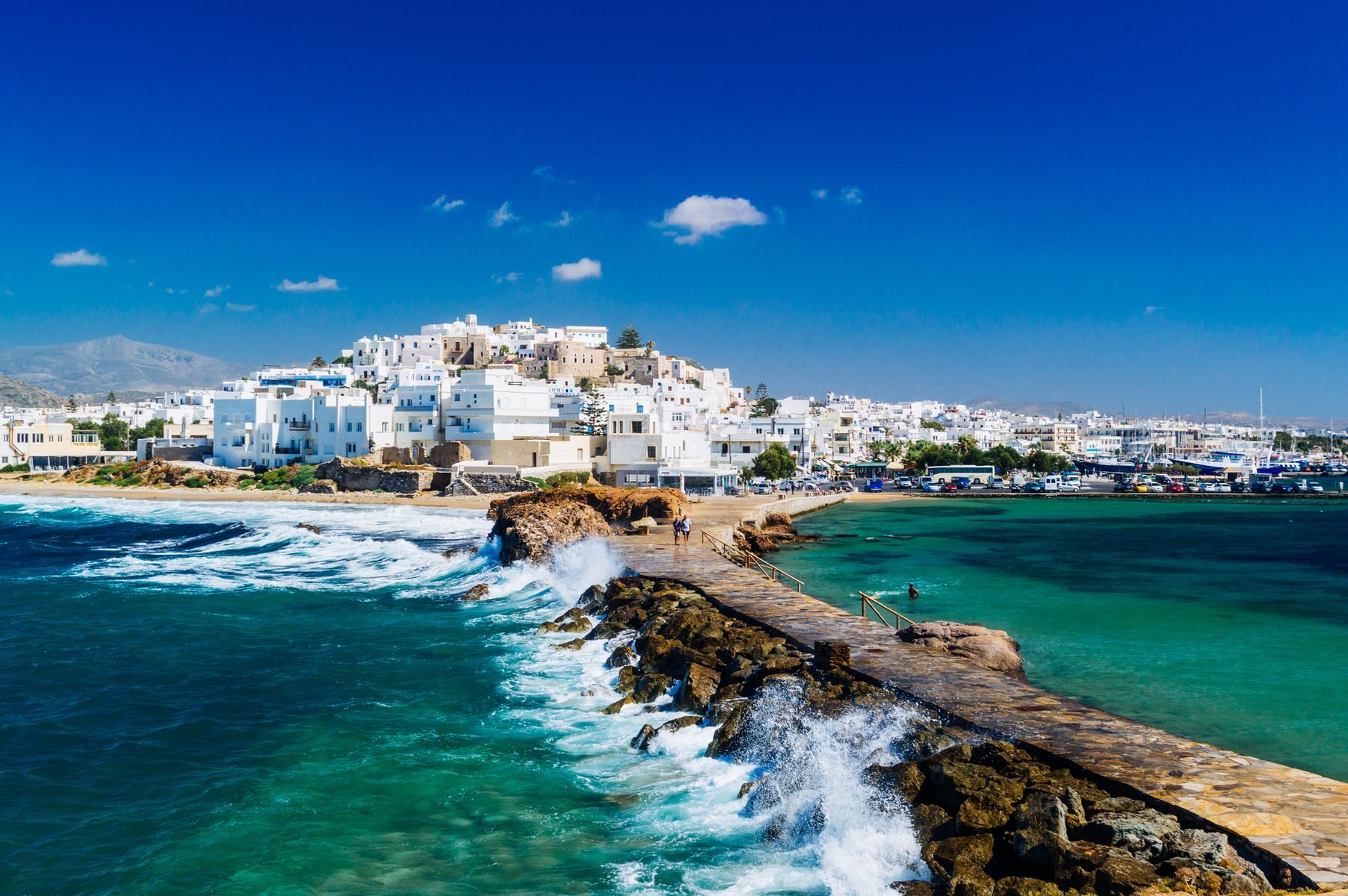 Largest of the <a href="https://www.visitgreece.gr/islands/cyclades/" rel="noreferrer noopener">Cyclades Islands</a>, <a href="https://www.discovergreece.com/cyclades/naxos" rel="noreferrer noopener">Naxos</a> is well known for its emblematic <a href="https://www.naxos.gr/the-temple-of-apollo-portara/?lang=en" rel="noreferrer noopener">Apollo Gate</a> and <a href="https://www.greeka.com/cyclades/naxos/sightseeing/naxos-temple-demeter/" rel="noreferrer noopener">Temple of Demeter</a>. Visitors can also unwind with a stroll through the bucolic streets of the medieval village of <a href="https://www.discovergreece.com/experiences/walking-tour-naxos-hora-complete-island-town" rel="noreferrer noopener">Hora</a> or along the golden sandy beaches of <a href="https://www.naxos.gr/plaka-beach/?lang=en" rel="noreferrer noopener">Pla</a><a href="https://www.naxos.gr/plaka-beach/?lang=en" rel="noreferrer noopener">k</a><a href="https://www.naxos.gr/plaka-beach/?lang=en" rel="noreferrer noopener">a</a> and <a href="https://www.naxos.net/beaches/agios-prokopios/" rel="noreferrer noopener">Agios Prokopios</a>. More active travellers may opt for a hike to the summit of <a href="http://www.cyclades.mobi/hilite-00000000000132-en.html" rel="noreferrer noopener">Mount Zas</a>, the Cyclades’ highest peak and a great spot for exceptional panoramic views.