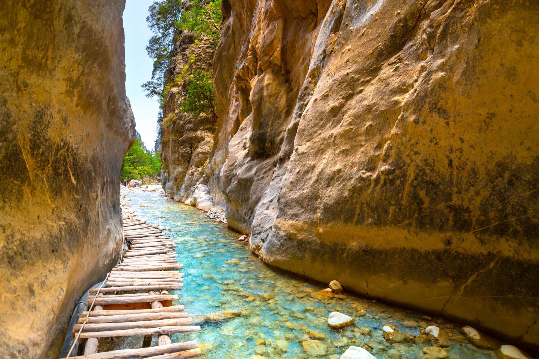 Hiking enthusiasts are in for an unforgettable experience at <a href="https://www.discovergreece.com/experiences/hiking-spectacular-samaria-gorge-chania" rel="noreferrer noopener">Samaria National Park</a> on the island of Crete. Its gorges number among the longest in Europe as they wind through dizzying rock faces with magnificent views of the wilderness. Amid strikingly lush vegetation (from May to October), enjoy unique flora and fauna and marvel at a narrow section called the <a href="https://www.hikingproject.com/gem/859/samaria-gorge-iron-gates" rel="noreferrer noopener">Iron Gates</a>, where the surrounding cliffs draw impressively close to one another.