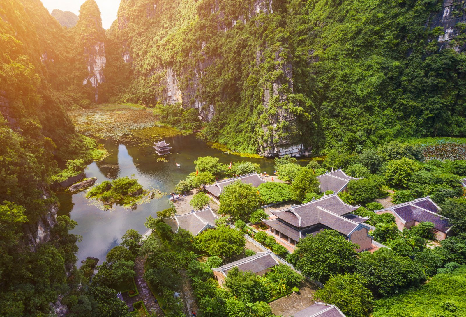 <p class="wp-caption-text">Image Credit: Shutterstock / CravenA</p>  <p><span>Often referred to as the “Halong Bay on Land,” Tam Coc – Bich Dong in Ninh Binh province offers a stunning landscape of limestone karst peaks, surrounded by rice paddies and intersected by serene rivers. A boat ride through Tam Coc reveals three natural caves formed in the limestone hills, while Bich Dong Pagoda offers a spiritual retreat with its ancient pagodas built into the limestone cliffs. The area is also known for its cycling routes, allowing visitors to explore the countryside and its traditional villages.</span></p>