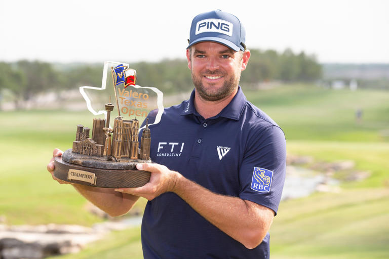 Apr 2, 2023; San Antonio, Texas, USA; Corey Conners poses with the winner's trophy following the final round of the Valero Texas Open golf tournament at TPC San Antonio. Mandatory Credit: Raymond Carlin III-USA TODAY Sports