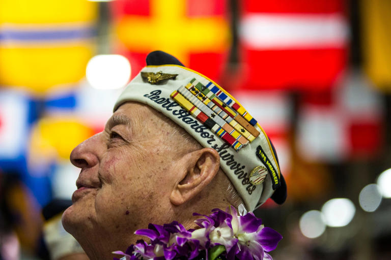 U.S.S. Arizona crewmember Lou Conter awaiting the start of a memorial service marking the 74th Anniversary of the attack on the U.S. naval base at Pearl Harbor on December 07, 2015, on the island of Oahu at the Kilo Pier at Joint Base Pearl Harbor-Hickam in Honolulu, Hawaii.