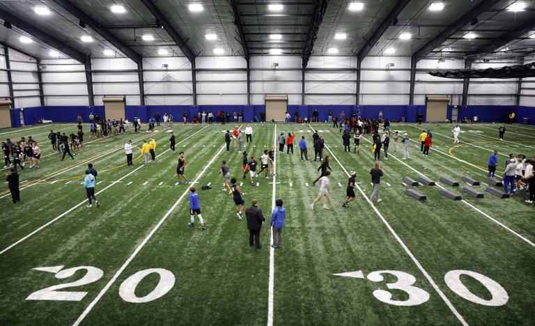 Unsigned senior football players ran drills before college scouts at the DFW Unsigned Senior Showcase at North Crowley High School in Fort Worth, January 25, 2023. Scouts from Division 2 and 3 schools along with JUCO and NAIA schools showed up.
