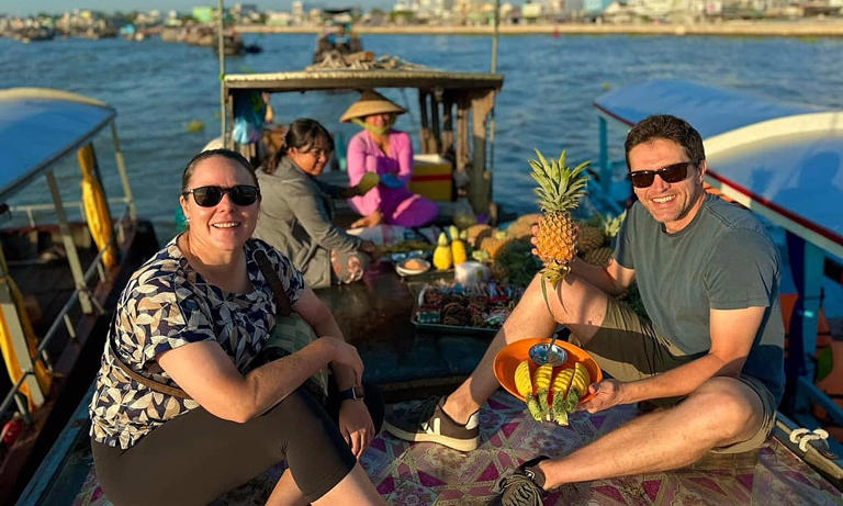 Foreign tourists enjoy a boat tour on Cai Rang floating market in Can Tho City, Mekong Delta, January 2024. Photo by Kieu Phi
