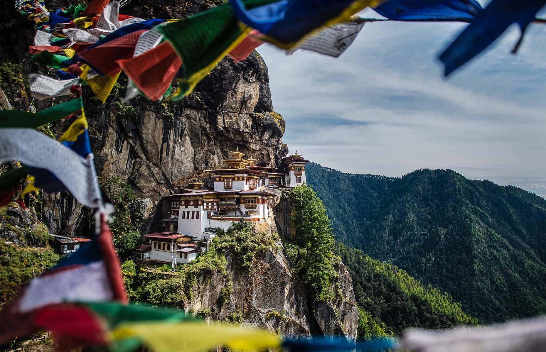<p>Bhutan is the world’s only carbon-negative country thanks to its vast forests, which cover 70% of the country’s land. It’s a trend-setter in sustainability in other ways too, charging tourists a sustainable development fee – which has fluctuated in price up to $200 (£157) a day, but was reduced to $100 (£79) per day in 2023 – to ensure that landmarks such as the Paro Taktsang (Tiger’s Nest, pictured) monastery and the cross-country Trans-Bhutan Trail can be explored responsibly. </p>