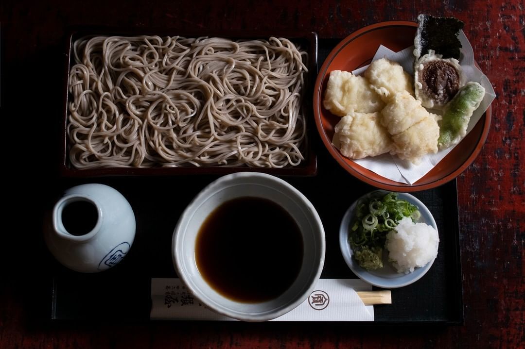 <p>Founded in Kyoto in <a href="https://www.atlasobscura.com/places/honke-owariya">1465</a>, Honke Owariya initially sold cakes made from soba (buckwheat) rice cakes. Soon after, however, the establishment branched out into providing soba to <a href="https://honke-owariya.co.jp/en/the-story-of-owariya/">Zen Buddhist temples</a> and Japan’s Imperial Palace. </p> <p>Today, it’s known to visitors as one of the most beloved places in Kyoto for eating soba noodles. Its specialty? Soba noodles with eight toppings: shiitake mushrooms, nori (seaweed), sliced egg, sesame seeds, wasabi, leeks, shrimp tempura and grated daikon. </p>