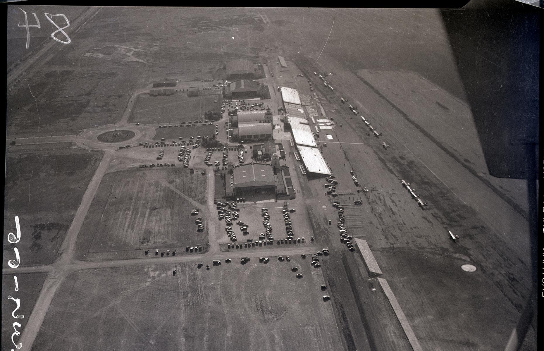 <p>LAX’s humble beginnings belie its modern mega-airport status. From as early as 1925, aviators were leasing the land (then fields of barley, beans and wheat) around where the airport now stands in order to fly their planes. One of these fields, Mines Field, was chosen as the site for Los Angeles’ municipal airport in 1928. The soon-to-be airport hosted the National Air Races later that year, and again in 1933 (pictured). Los Angeles Municipal Airport was officially dedicated in 1930 and within a few years was regarded as a major aircraft center.</p>