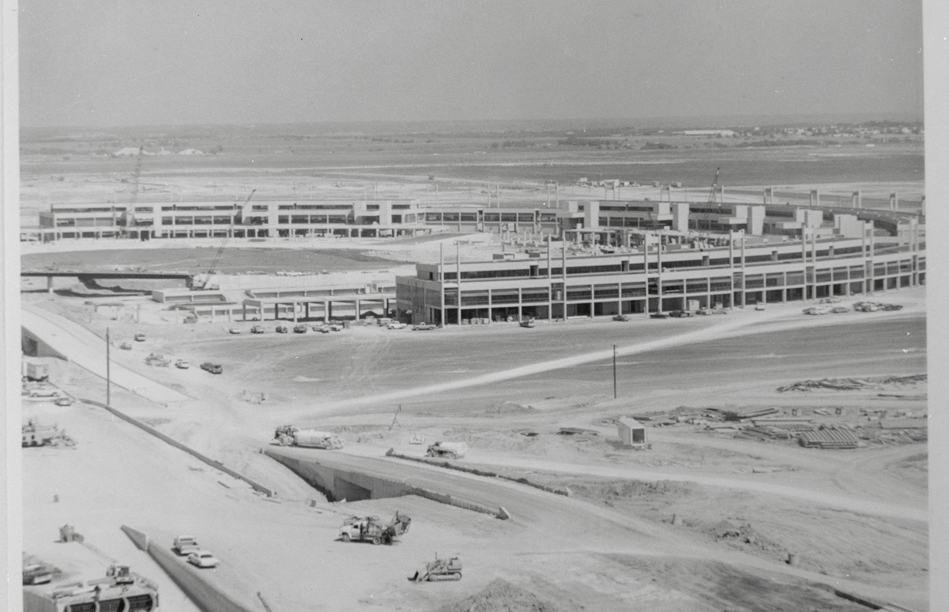 <p>Although Dallas-Fort Worth International Airport (pictured here during construction) didn’t begin operations until 1974, it formed as an idea much earlier. Before DFW opened people were flying between the two cities on a regular basis, prompting discussions about building a large airport in between them as far back as the 1930s. The first collaboration was a small military airport erected between the two cities during the Second World War, but it took another three decades for Dallas and Fort Worth to agree on where to build a shared commercial airport.</p>