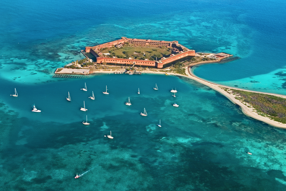 <p>Comprised of<strong> seven beautiful reef islands</strong>, Dry Tortugas National Park is the perfect place for snorkeling and basking on pristine sandy beaches. </p>  <p>To get the park, you’ll have to take a catamaran boat from Key West, about 70 miles away.</p>