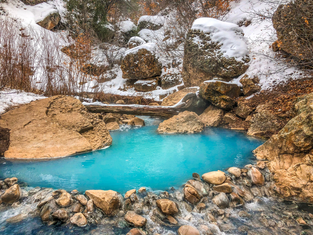 <p>Located 30 minutes from Provo, Utah.</p>  <p>These natural hot springs are also known as <em>Fifth Water Hot Springs</em>, and feature several hot spring pools with <strong>glacier blue waters</strong> and a beautiful waterfall.</p>