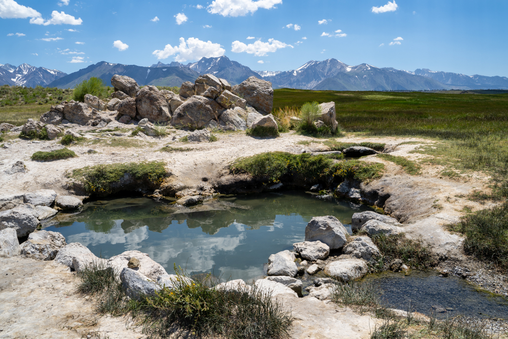 <p>Located about 20 minutes east of Mammoth Lakes.</p>  <p>These natural hot springs are larger than most and can fit close to 30 people, with a stunning <strong>360-degree view</strong> of the majestic mountains.</p>