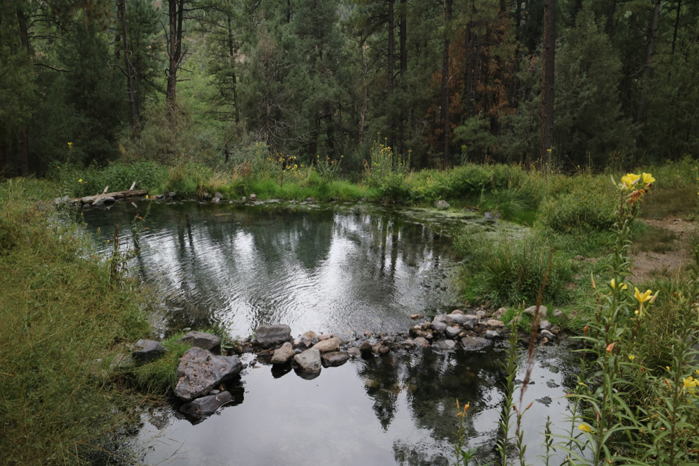 <p>Visitors can expect a bit more of a challenge getting to these hot springs. They are located about a half-mile hike through the Santa Fe National Forest.</p>  <p>The entire area is free to visit, but camping is not permitted.</p>