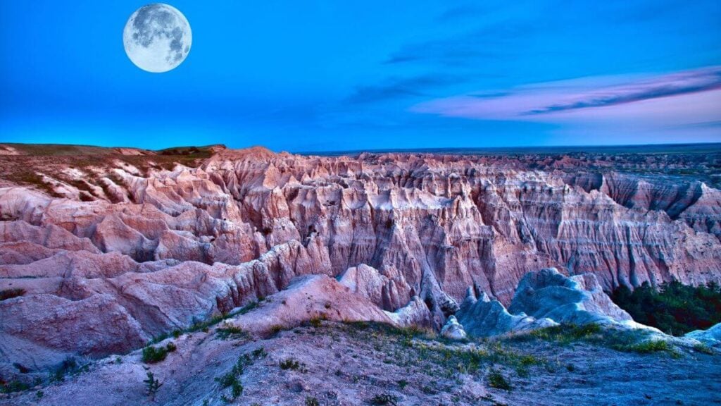 <p>The Badlands National Park is nestled in the rural area of <a href="https://www.thewaywardhome.com/how-to-become-a-south-dakota-resident/" rel="noopener">South Dakota</a>. You can stay at the Cedar Pass or Sage Creek Campgrounds. For the former, make sure you make a reservation first; for the latter, come early to get the best spot. Cedar Pass Lodge also offers a cabin you can book for the night. </p>