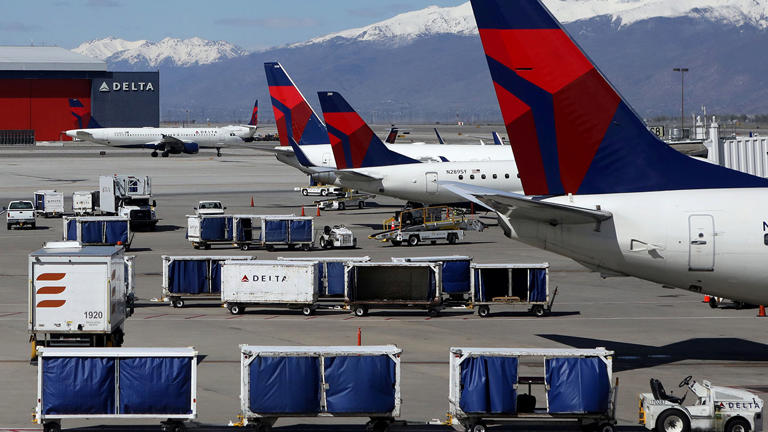 Delta Airlines planes are loaded and unloaded at Salt Lake City International Airport in April 2020. Reuters/Jim Urquhart