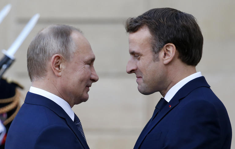 French President Emmanuel Macron welcomes Russian President, Vladimir Putin as he arrives at the Elysee Presidential Palace to attend a summit on Ukraine on December 09, 2019 in Paris, France. A Russian state TV host has expressed alarm over French Macron doubling down on the possibility of sending ground troops into Ukraine.