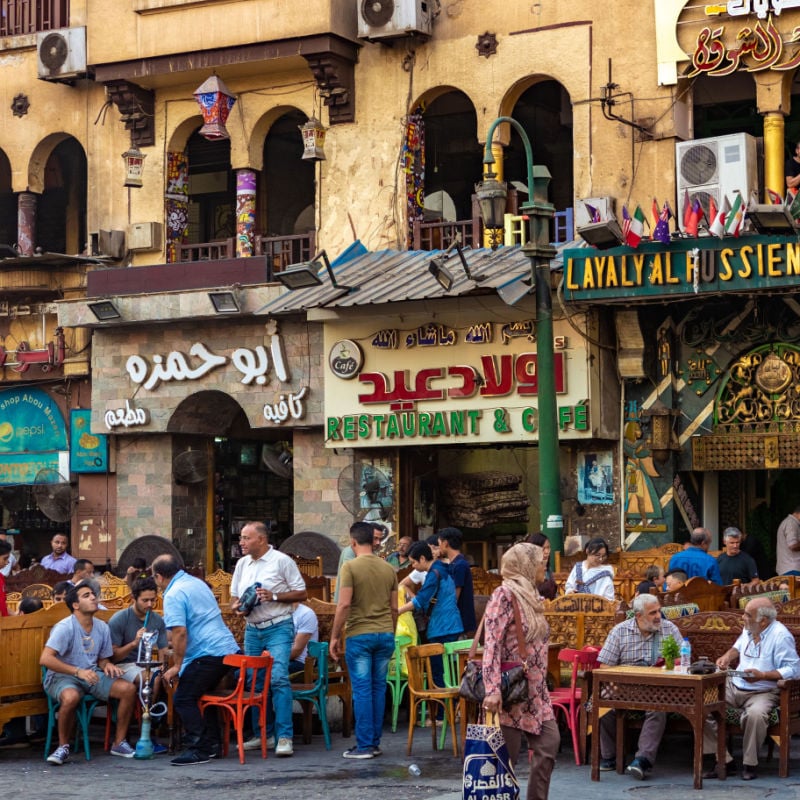 people sit outside cafes to eat and smoke in Cairo Egypt