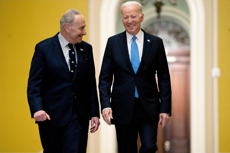 President Joe Biden speaks with Senate Majority Leader Chuck Schumer, left, as he arrives to attend the Senate Democrat policy luncheon at the U.S. Capitol in Washington, D.C., on March 2, 2023.