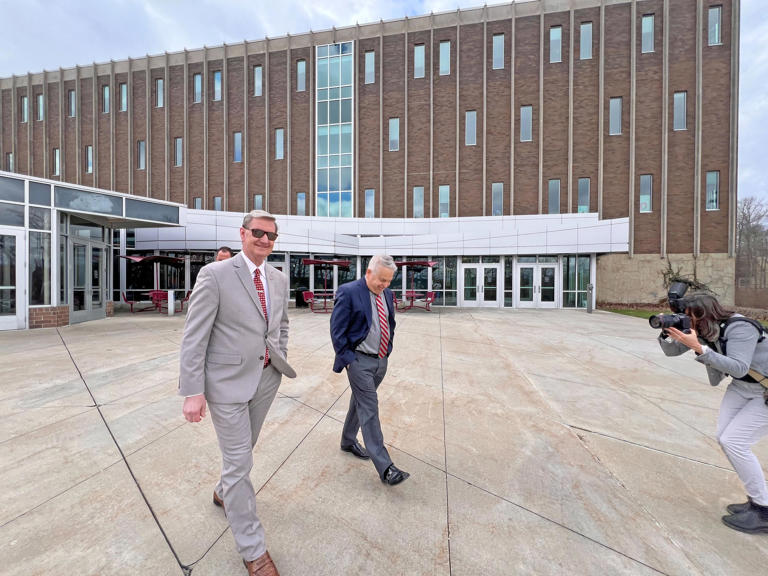 Ohio State University president Walter "Ted" Carter Jr. leaves Ovalwood Hall in Mansfield after touring the Pearl Conard Art Gallery. Carter visited the university's regional campuses for the first time in his presidency this past week.