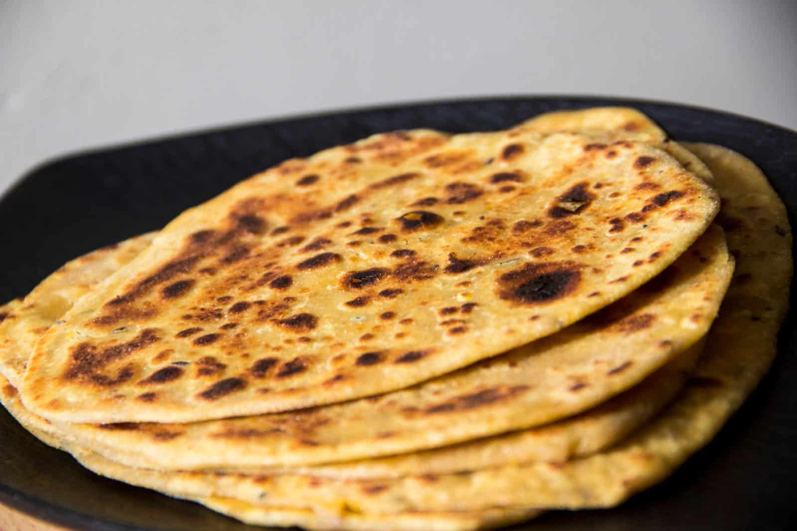 Image Credit: Shutterstock / prachi_sharma <p><span>As the sun sets over the rolling hills of Marche, indulge in crescia sfogliata, a traditional flatbread that’s as light and airy as a summer breeze. Made with layers of paper-thin dough and filled with savory ingredients like cheese, herbs, and cured meats, this delicate bread is a beloved specialty of Urbino. Pair it with a glass of local wine and watch the colors of the sky change as you savor every bite.</span></p>