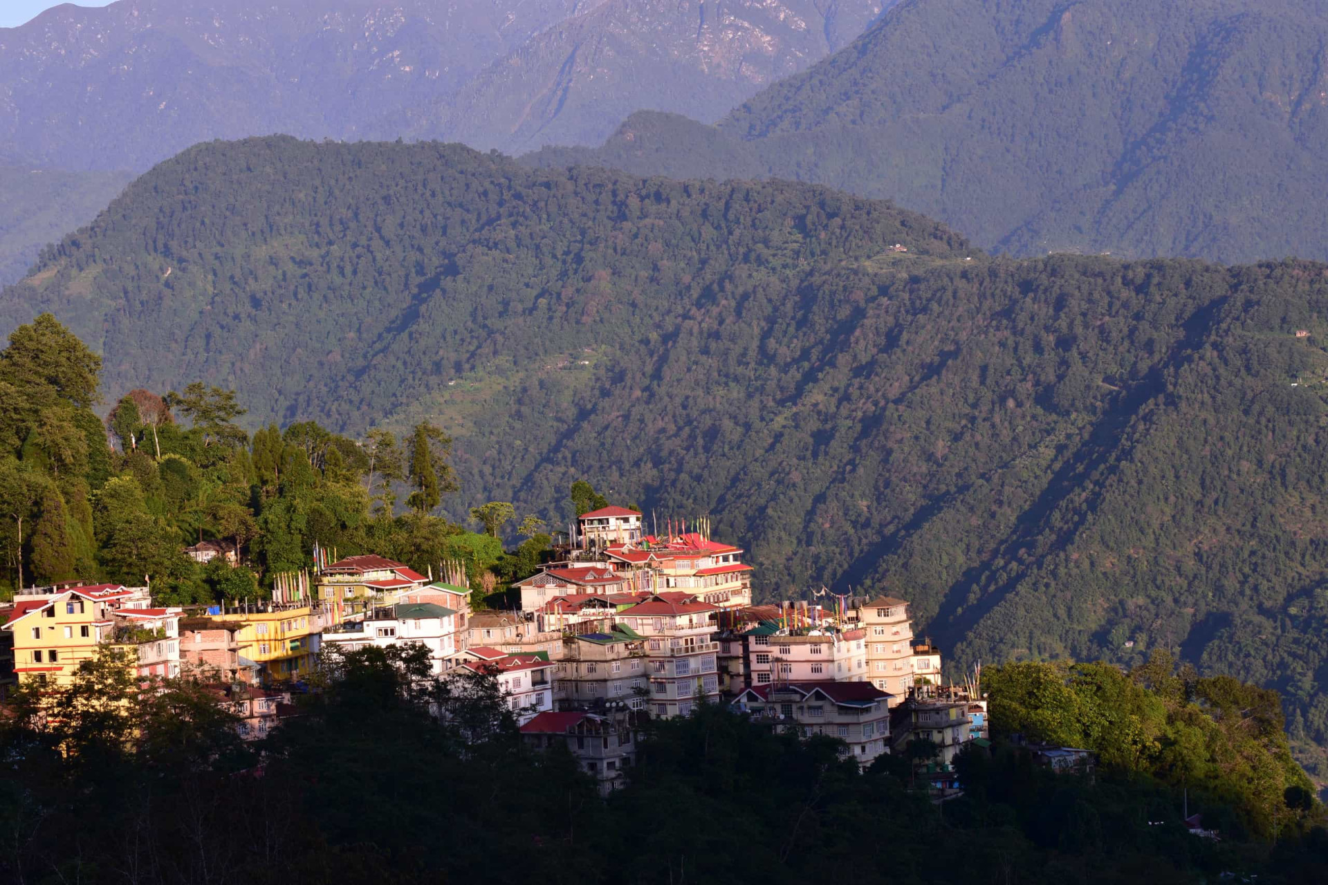 <p>Sikkim, a state in northeastern India, is where to find Pelling, a hill station known as a primary location for trekkers and mountaineers who prefer to set their base here before moving on to the high altitude trek routes into the snow capped​ Eastern Himalayas and the forbidding Kanchenjunga range.</p>
