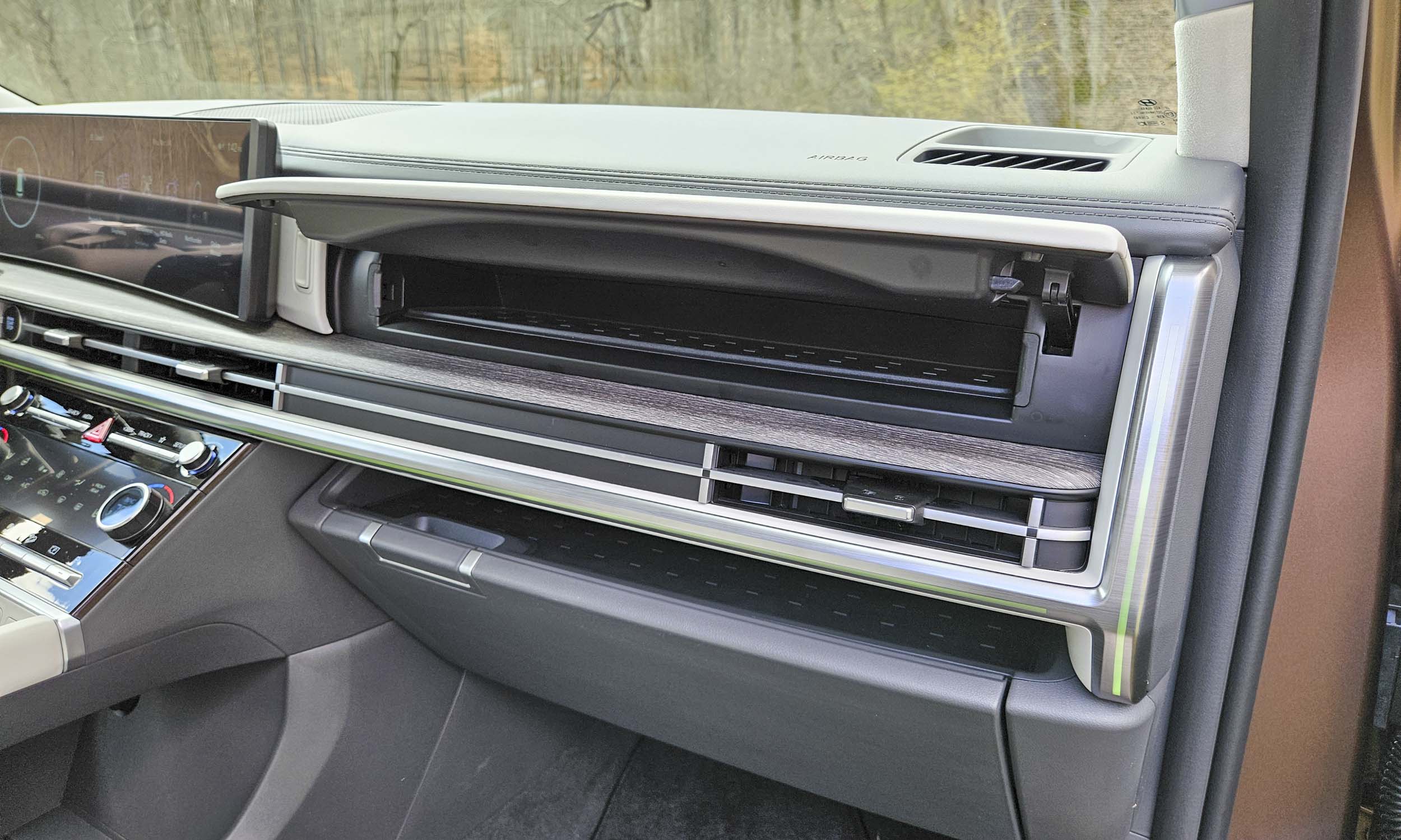 <p>          A unique feature of the updated Santa Fe is the available second compartment above the typical glove box. Not only does this space offer additional storage, but it also features a UV-C sterilization system. After about ten minutes, items placed in the compartment will be free of bacteria and viruses. But you’ll still have to clean the fingerprints off the screen.         </p>