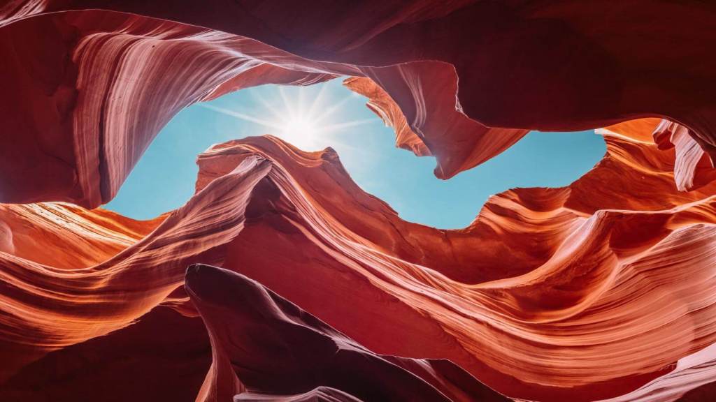 <p>The narrow passageways, the gently curving walls, and the delicate patterns on the wall surfaces make Antelope Canyon a mesmerizing destination that every nature lover should visit.</p><p>Wait until you witness the sun rays streaming into the canyon, illuminating the sandstone walls in vibrant hues of red, orange, and gold. The interplay the light beams create makes the canyon a haven for photographers. This phenomenon is best captured in the mid-mornings and early afternoons.</p><p class="has-text-align-center has-medium-font-size">Read also: <a href="https://worldwildschooling.com/instagrammable-spots-in-the-us/">Insta-Worthy Spots in the US</a></p>