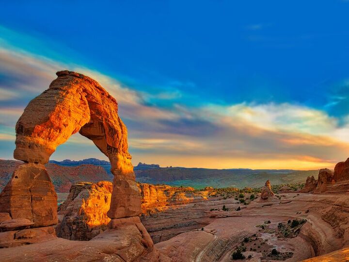 <p><span>Discover the world-famous red rock formations of Arches National Park, including the iconic Delicate Arch. Spring offers comfortable hiking conditions to explore the park's over 2,000 natural stone arches. </span><em>Image credit: Canva</em></p>