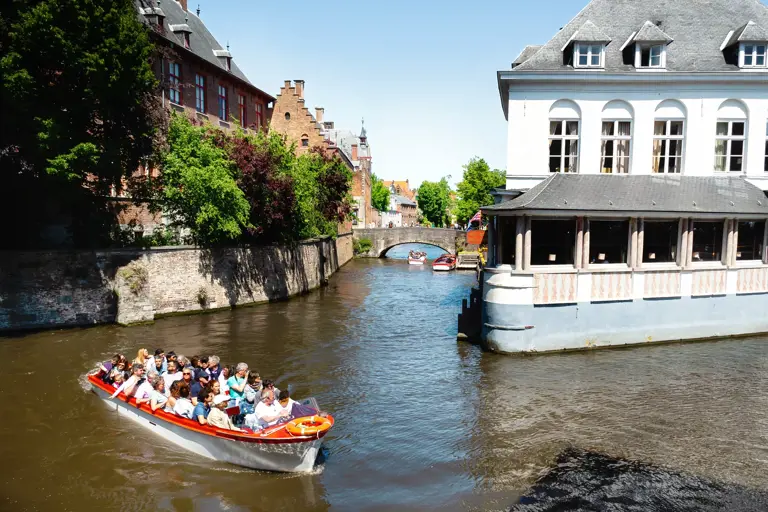 There are few things more magical than a canal tour of Bruges, Belgium! In this travel blog post, I share everything you need to know about Bruges canal cruises!
