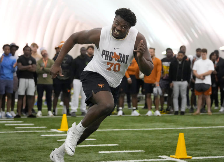 Texas RT Christian Jones gets handson work with Saints coach at pro day