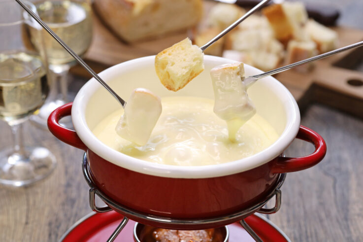 <p>When visiting Zurich, you won’t have trouble finding two of Switzerland’s signature foods: fondue and raclette. Many restaurants in the city, such as Restaurant Swiss Chuchi, Raclette Factory, and Walliser Keller, serve these dishes. In winter, the city also has a <a href="https://www.zuerich.com/en/visit/restaurants/fondue-tram">vintage fondue tram</a>, where you can enjoy delicious fondue on an exciting ride through the city. </p><p>Zurich is also a prime destination for chocolate lovers. The Lindt Home of Chocolate is a notable destination providing a deep dive into Swiss chocolate, with tastings and interactive exhibits. You can also try a Swiss <a href="https://68105.partner.viator.com/tours/Zurich/Zurich-Group-Chocolate-Tour/d577-33484P3">chocolate walking tour</a> to indulge in a variety of chocolate treats. Aside from cheese and chocolate, the city is home to several Michelin-starred restaurants like Ignev Zurich and Elmira. Head to Restaurant Krone Altstetten or Alpenrose for upscale and contemporary Swiss cuisine that is sure to delight. For those looking to sample a variety of Swiss specialties, <a href="https://www.zuerich.com/en/visit/weekly-markets-in-zurich">Zurich’s weekly markets</a> offer everything from artisan cheeses to handmade chocolates.</p>