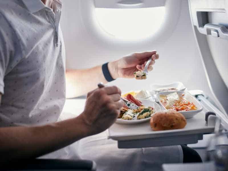 <p>You might think <a href="https://frenzhub.com/oddly-compelling-facts-about-the-food-youre-served-on-airplanes/" rel="noopener"><strong>airline food</strong></a> is an acquired taste. In truth, it’s more of an acquired survival strategy. Arm yourself with non-perishable, non-messy snacks for that inevitable mid-flight hunger pang. Nuts, granola bars, and dried fruit are delicious and beneficial for keeping your energy levels up and less reliant on the in-flight cuisine.</p>