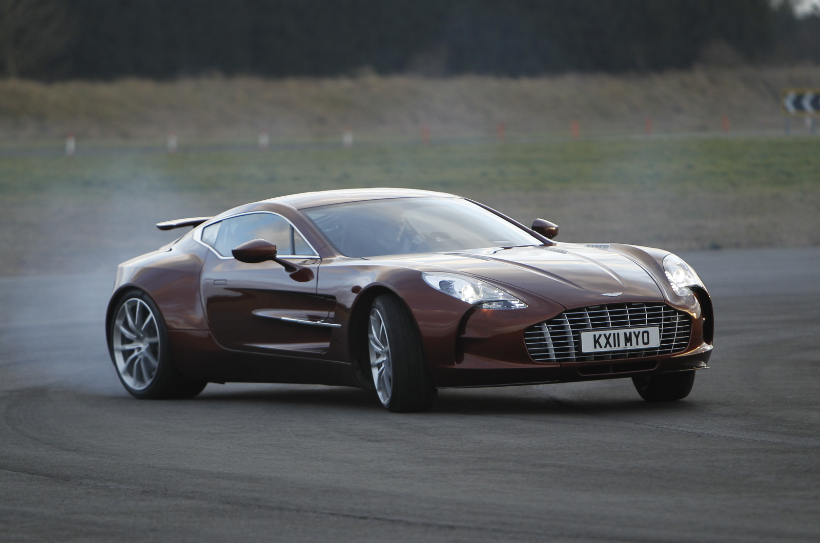 <p>Given its rarity and <strong>£1.4 million</strong> price tag when new, it’s understandable Aston Martin went all out with the One-77 and its V12 engine. The engine mounts are machined from solid <strong>billets</strong> of aluminum and the 7.3-liter motor itself was handed over to <strong>Cosworth</strong> to develop and build. Their brief was to create a motor with at least 700bhp and an all-up weight 10 per cent lower than the standard V12 it was based on.</p><p>Cosworth came up trumps with <strong>760 hp</strong> and shed 15 per cent of the weight by ditching the standard unit’s shrunk-in cylinder liners in favor of a spray-on coating for the bores. Compared to a DBS, the One-77’s engine had variable valve timing and is also positioned further back and a whole <strong>4 inches </strong>lower in the chassis for better weight distribution and handling. It also gained a rear-mounted gearbox for the same reason.</p>