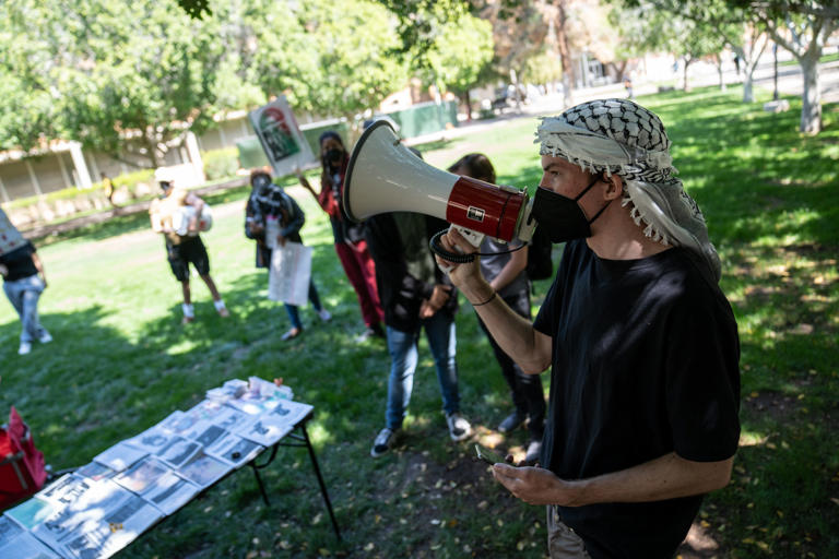 Pearse Kelly speaks during a protest organized by Students Against Apartheid in support of MECHA, a club that was suspended after a pro-Palestine post, at Arizona State University in Tempe on March 21, 2024.