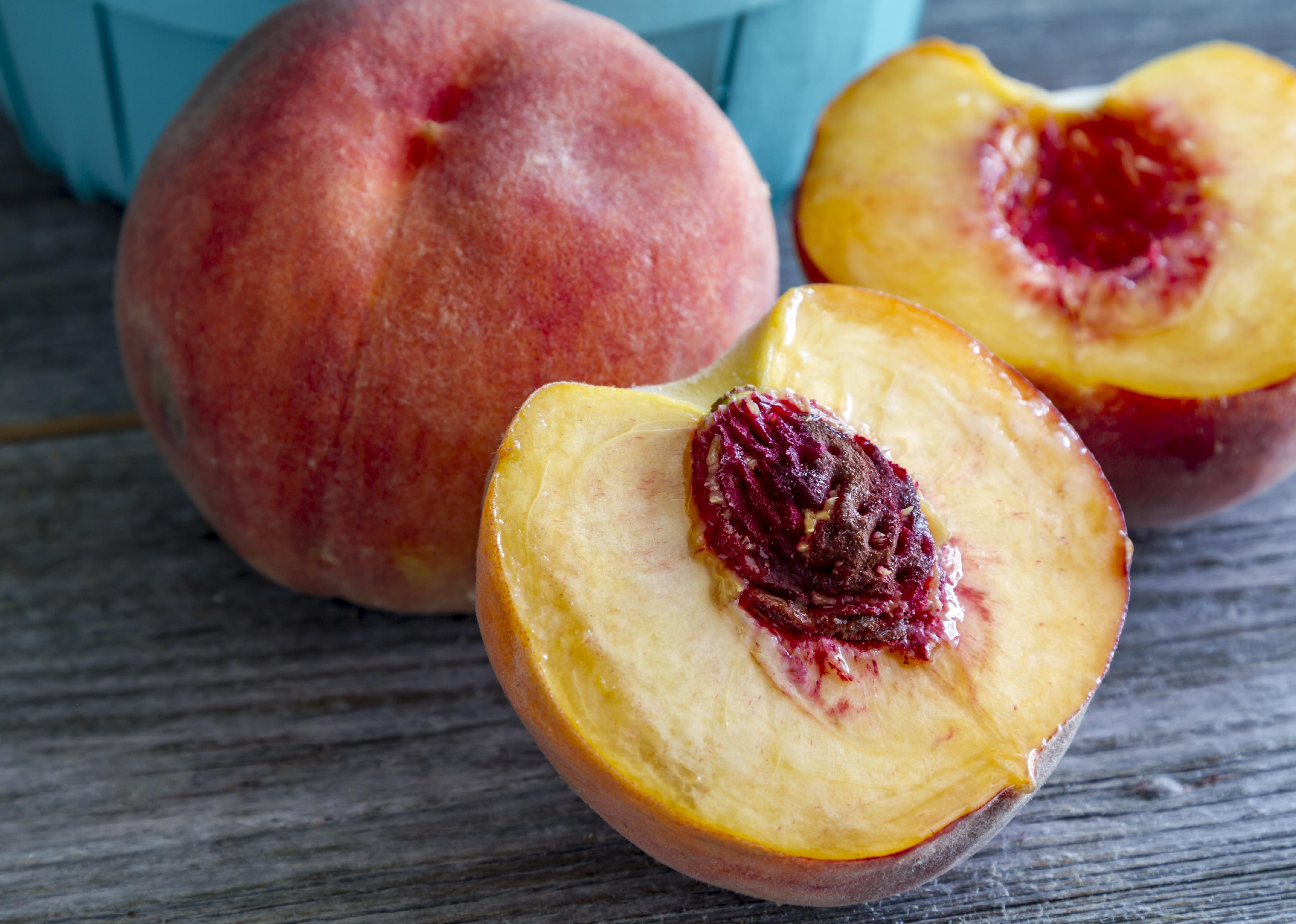 <p>What's in a peach? If you live in central or southern Atlanta, or any of the Gulf states, you'll find a "<a href="https://dare.news.wisc.edu/same-thing-different-words-synonyms-by-region/index.html">kernel</a>" buried in the center of a peach. But those who eat their peaches in the Pacific Northwest or in northern states, get rid of their "pits." While those across the country refer to the seeds as "stones," the term is most commonly used in the Midwest states. Regardless of the term you use, it's good to know that you can <a href="https://www.phillyorchards.org/2015/07/07/growing-peaches-from-seed/">grow your own peach tree</a> right from your favorite kitchen.</p>