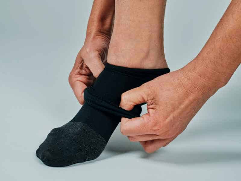 <p>Sitting still for hours is nobody’s idea of a good time. Invest in compression socks to stave off stiffness and reduce the risk of blood clots. Your heart (and, more importantly, your leg circulation) will thank you, especially on longer flights.</p>