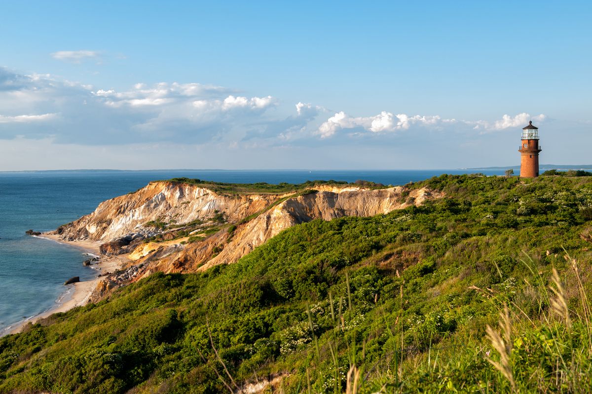<p>With its dramatic multi-colored clay cliffs, golden sands, and crystal-clear waters, Aquinnah Beach provides a stunning backdrop for a day of fun in the sun. Its timeless charm and unparalleled beauty make the half-mile stretch of coastline ideal for travelers looking to experience the true essence of Martha’s Vineyard.</p>
