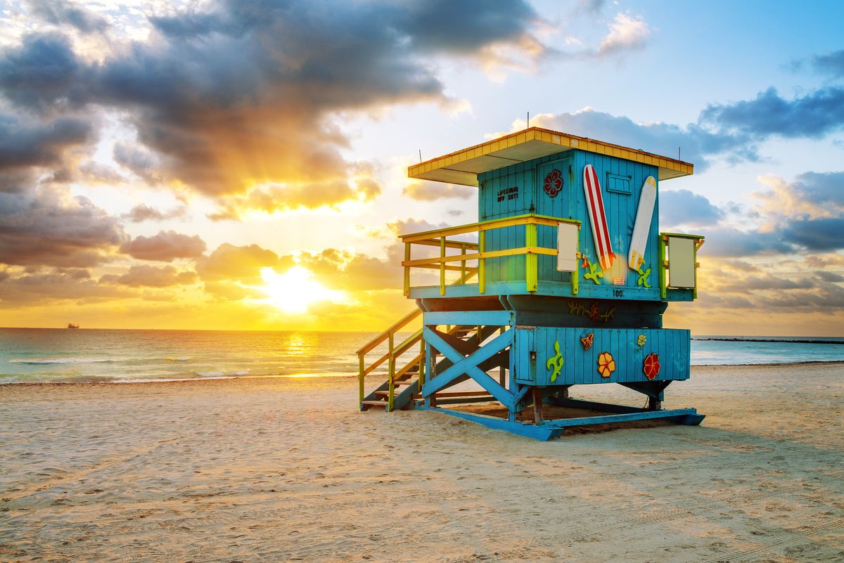 <p>The sizzling strip of shore that gave rise to an entire vacation destination, palm-fringed <a href="https://www.veranda.com/travel/weekend-guides/g46054123/what-to-do-in-miami/">Miami Beach</a> brings the heat with its year-round sunshine, golden sand, turquoise water, and colorful lifeguard houses. Umbrellas and loungers from various hotels line the beach—and it’s got some of the best people watching around. </p>