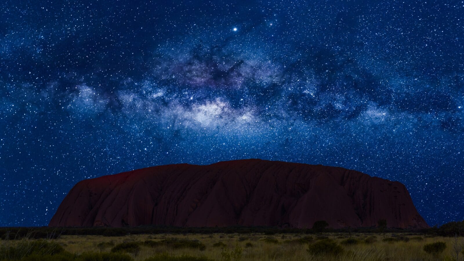 <p>Uluru Australia is home to quit a few exciting stargazing adventures. The Sounds of Silence tour is one of the best star viewing tours in the world and will take you on a trek through the iconic rock formations of Uluru which glow red at night. The dunes open up to a huge plateau where you can sit and dine on Aussie fare in the complete darkness while enjoying the otherworldly southern sky. With plenty of places to stay nearby, this is an easy stargazing destination to visit with your family. </p>